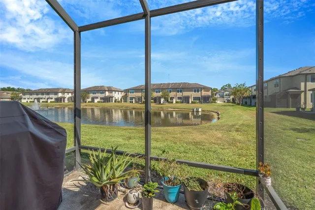 a view of a balcony with floor to ceiling windows with wooden floor