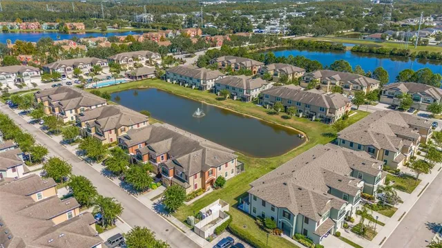 an aerial view of a city with lawn chairs