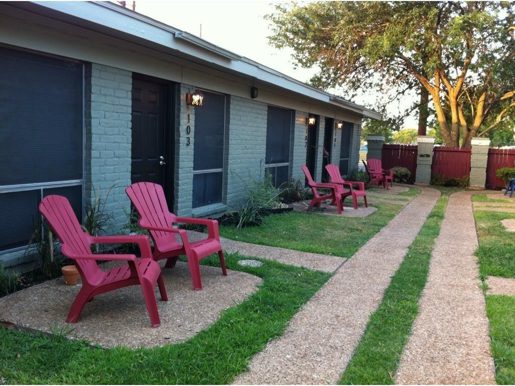 a view of a house with backyard porch and sitting area