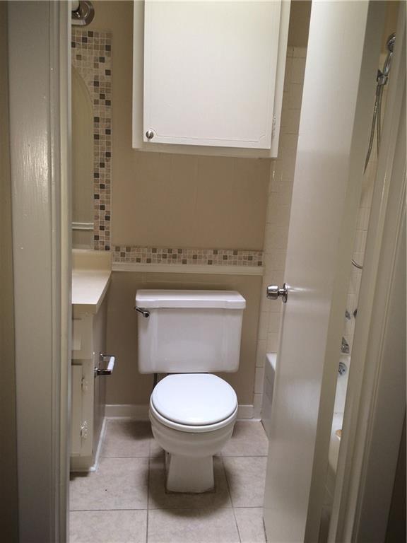 602 West 51st Street, Unit 101 Austin, TX 78751 - Photo 11 of 16 a toilet sitting in a bathroom next to a sink