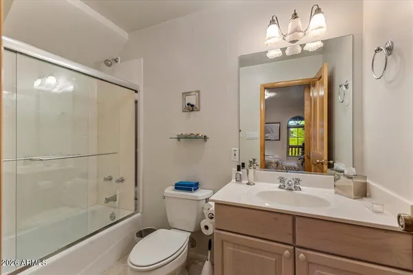 a bed sitting in a room next to a window