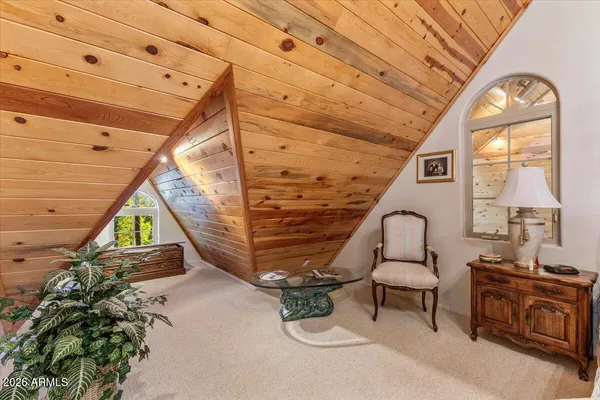 a view of a balcony with wooden floor