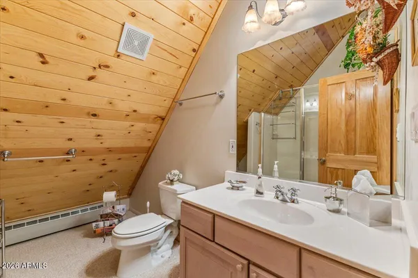 a view of house with a yard and trees