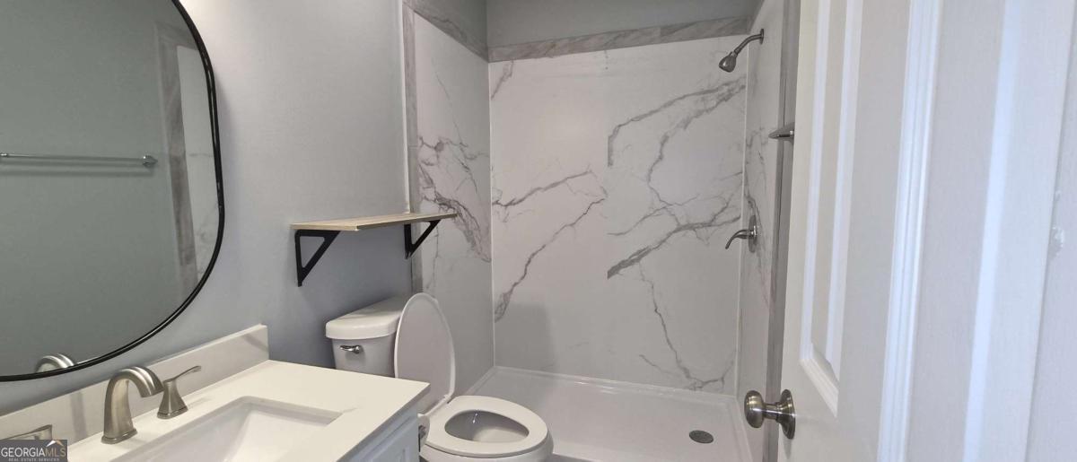 595 Macon Highway, Unit 5 Athens, GA 30606 - Photo 13 of 15 a bathroom with a sink and a mirror