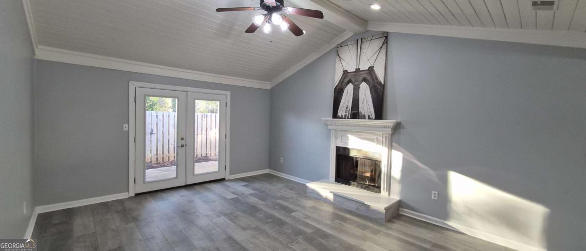 595 Macon Highway, Unit 5 Athens, GA 30606 - Photo 6 of 15 wooden floor in an empty room with a window