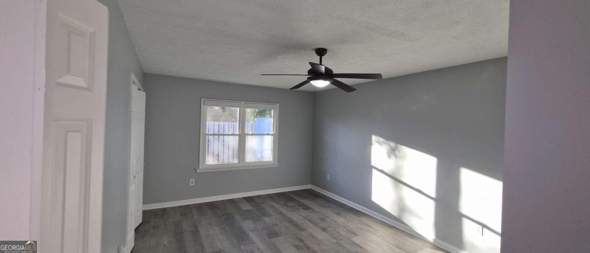 595 Macon Highway, Unit 5 Athens, GA 30606 - Photo 9 of 15 a view of an empty room with a window