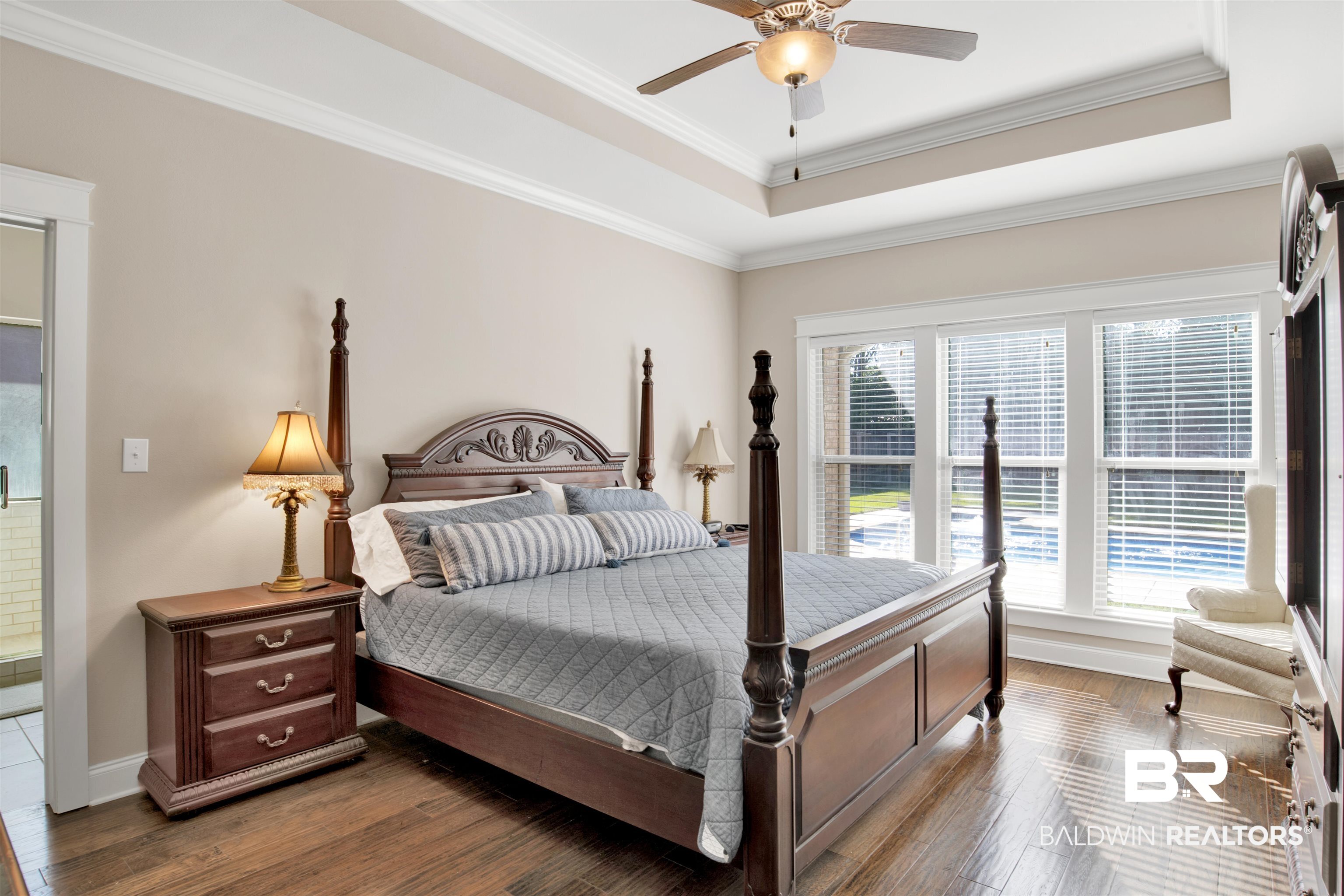 360 Scarlett Avenue Fairhope, AL 36532 - Photo 23 of 34 Bedroom with multiple windows, ornamental molding, dark hardwood / wood-style floors, and ceiling fan