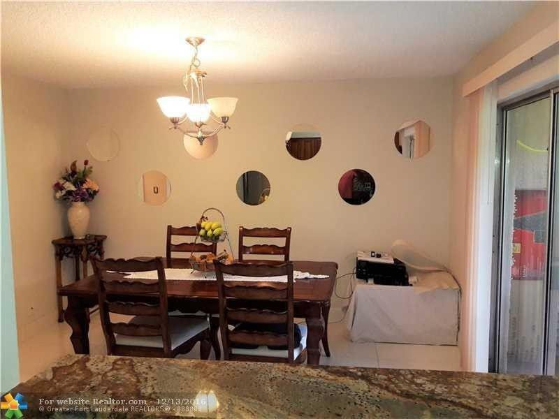 3316 Quail Close, Unit 21 Pompano Beach, FL 33064 - Photo 4 of 13 a view of a workspace room with wooden floor