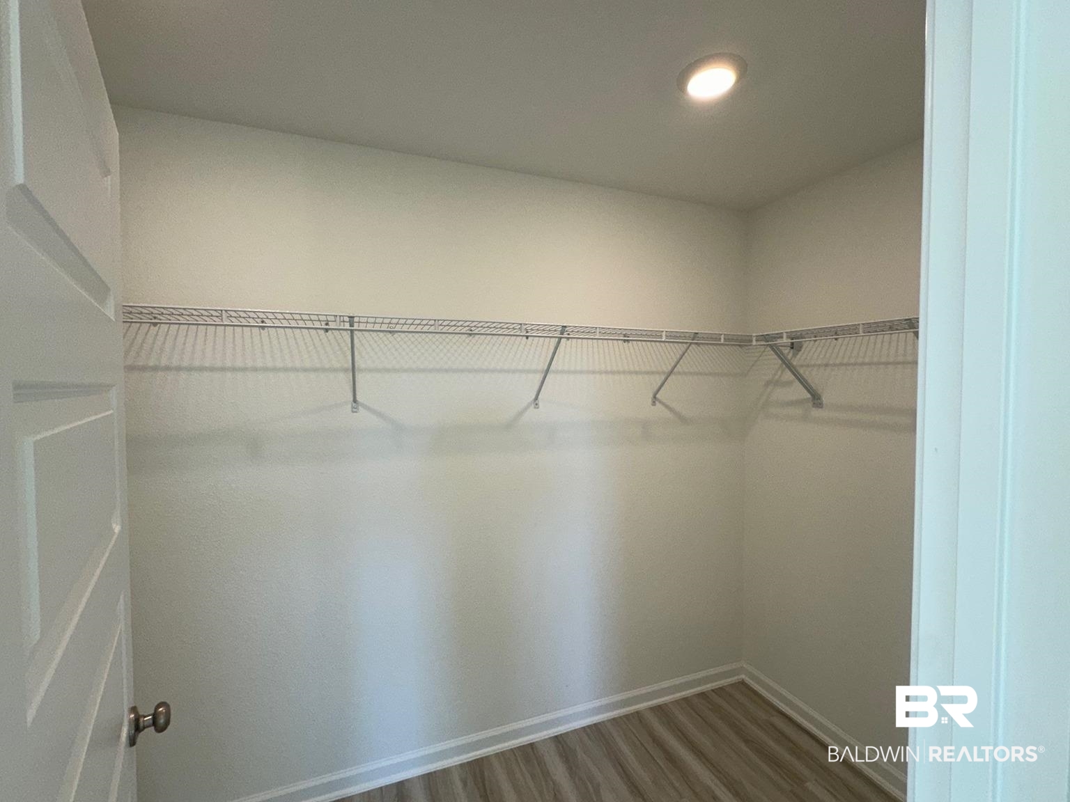 24385 Ringneck Loop Elberta, AL 36530 - Photo 13 of 33 Walk in closet featuring hardwood / wood-style floors