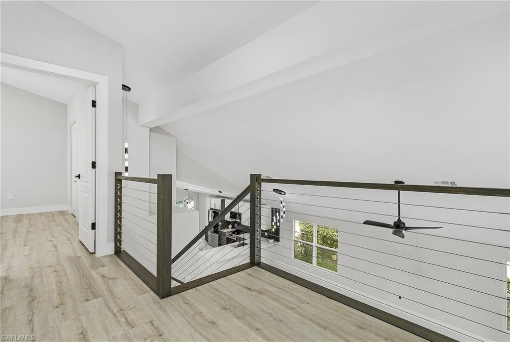 1601 Weybridge Circle, Unit 11 Naples, FL 34110 - Photo 14 of 34 a view of a hallway with wooden floor