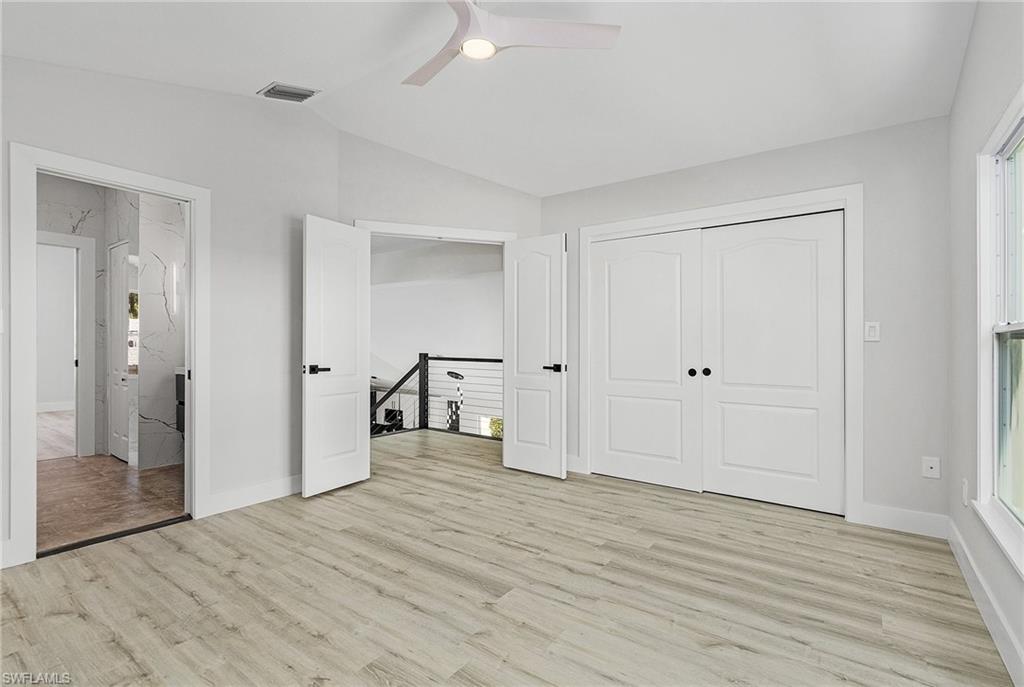 1601 Weybridge Circle, Unit 11 Naples, FL 34110 - Photo 19 of 34 wooden floor in an empty room