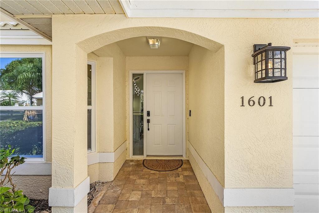 1601 Weybridge Circle, Unit 11 Naples, FL 34110 - Photo 26 of 34 a view of a hallway with front door