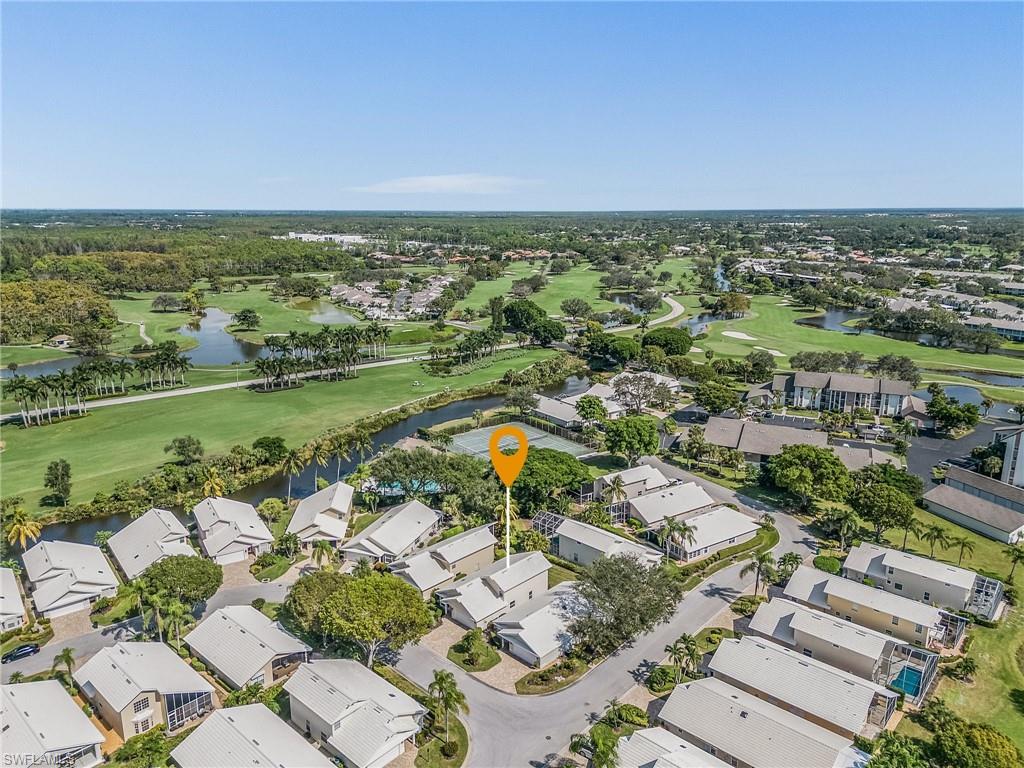 1601 Weybridge Circle, Unit 11 Naples, FL 34110 - Photo 30 of 34 an aerial view of residential houses with outdoor space