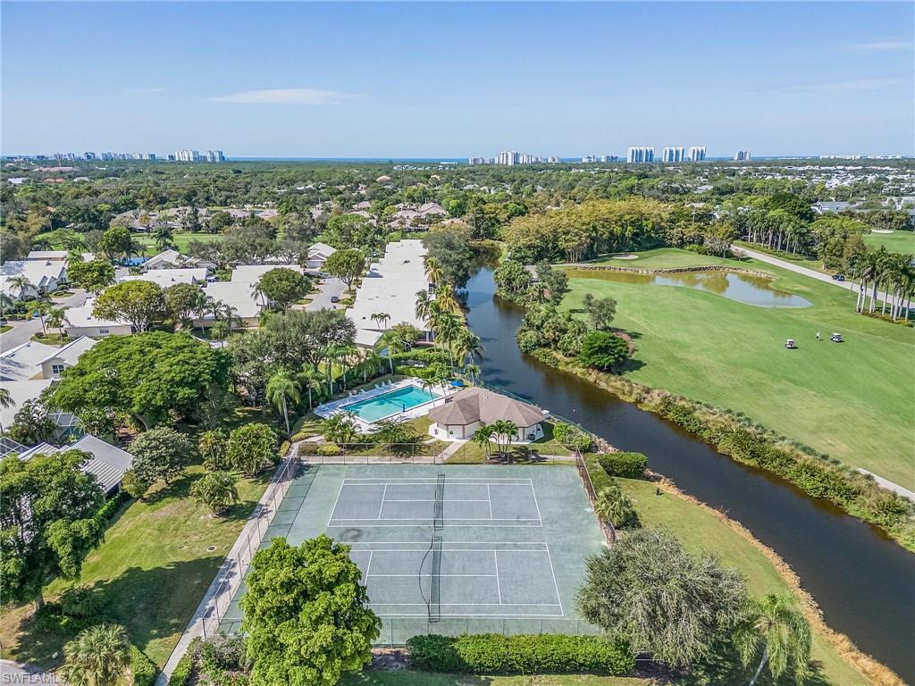 1601 Weybridge Circle, Unit 11 Naples, FL 34110 - Photo 32 of 34 a view of a city with an ocean