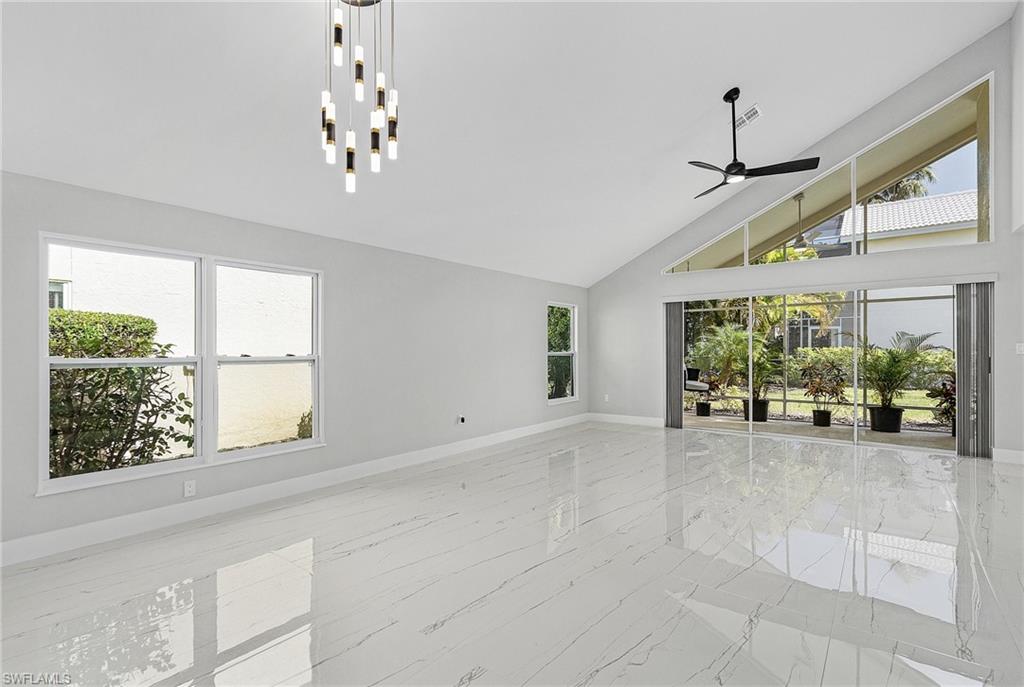1601 Weybridge Circle, Unit 11 Naples, FL 34110 - Photo 7 of 34 a view of livingroom with window