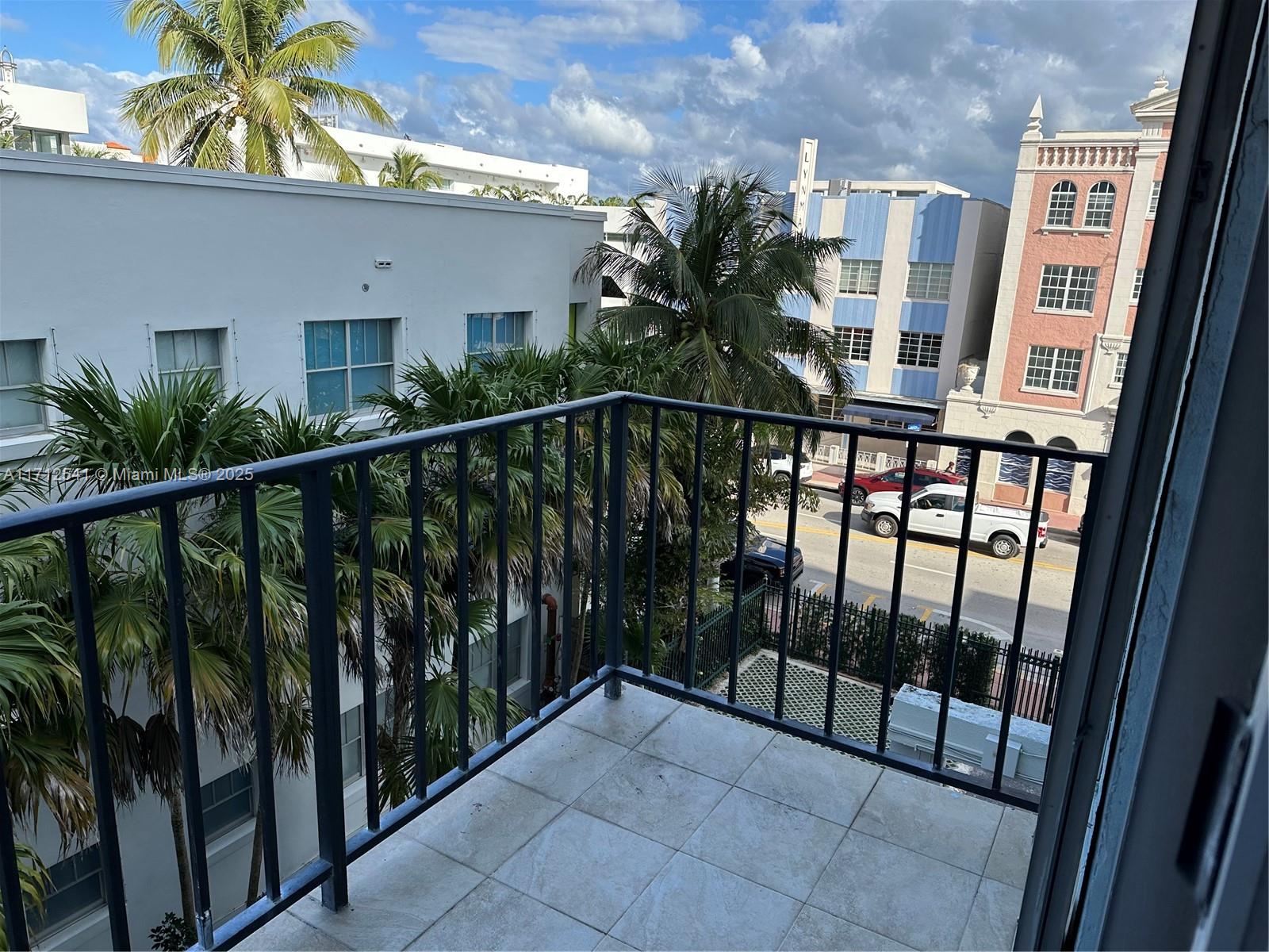 720 Collins Avenue, Unit 404 Miami Beach, FL 33139 - Photo 14 of 19 a view of a balcony with potted plants