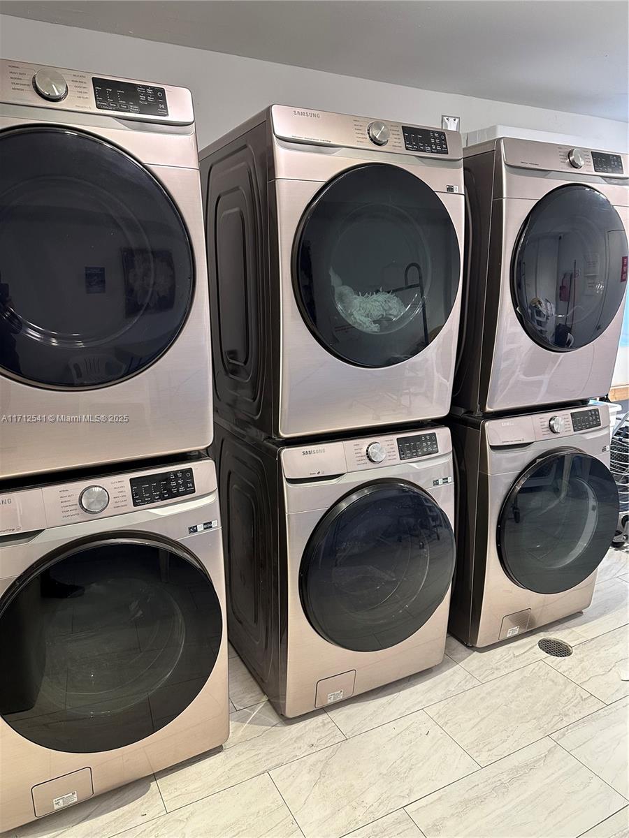 720 Collins Avenue, Unit 404 Miami Beach, FL 33139 - Photo 15 of 19 a utility room with dryer and washer