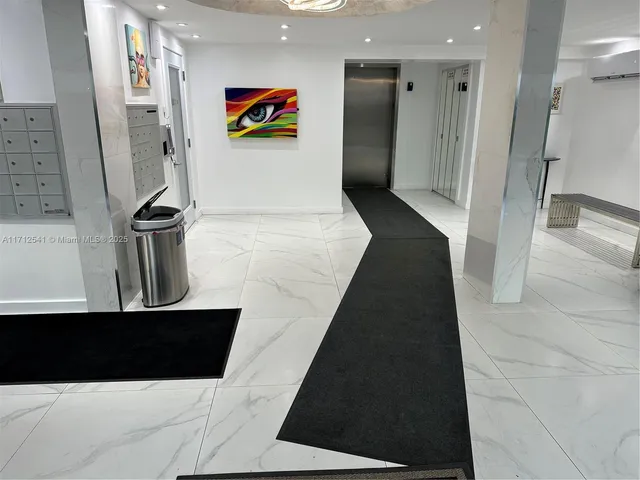 a kitchen with stainless steel appliances a refrigerator and a sink