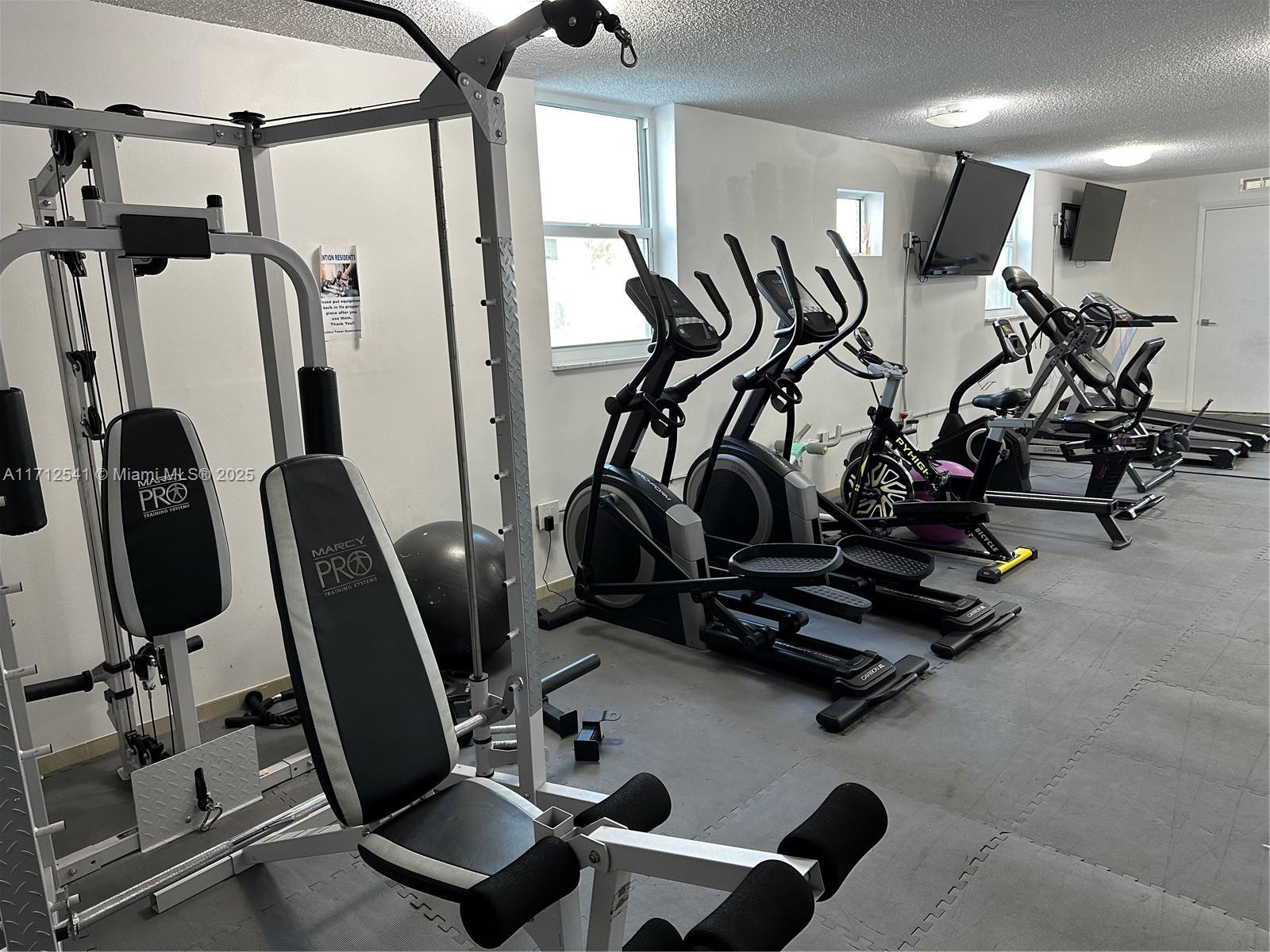 720 Collins Avenue, Unit 404 Miami Beach, FL 33139 - Photo 19 of 19 a view of a room with gym equipment