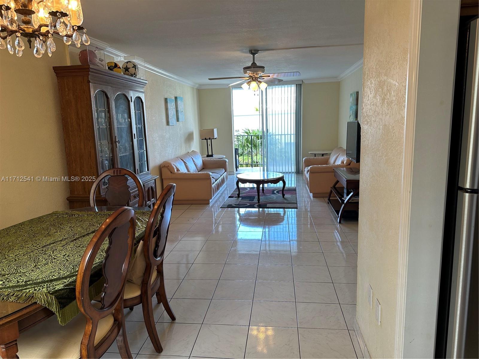 720 Collins Avenue, Unit 404 Miami Beach, FL 33139 - Photo 2 of 19 a dining room with furniture and window