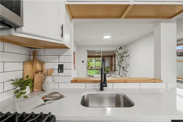a kitchen with a sink and a cabinets