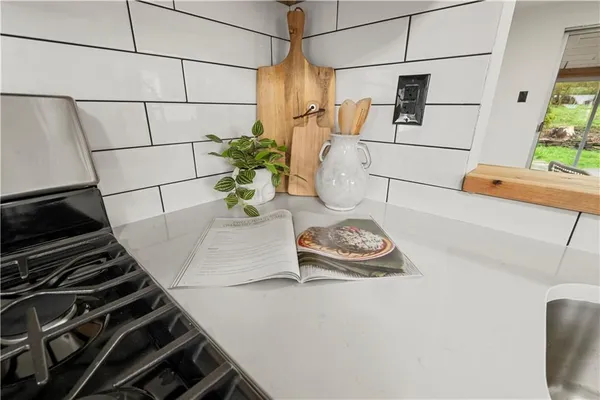a kitchen with a stove and a refrigerator