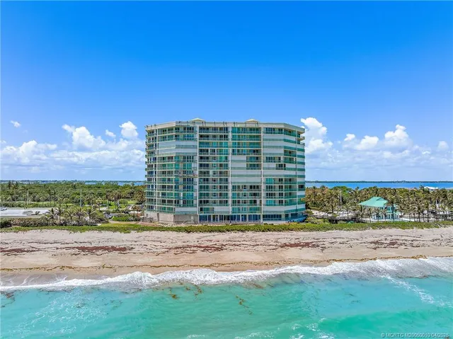 a view of a building with a yard