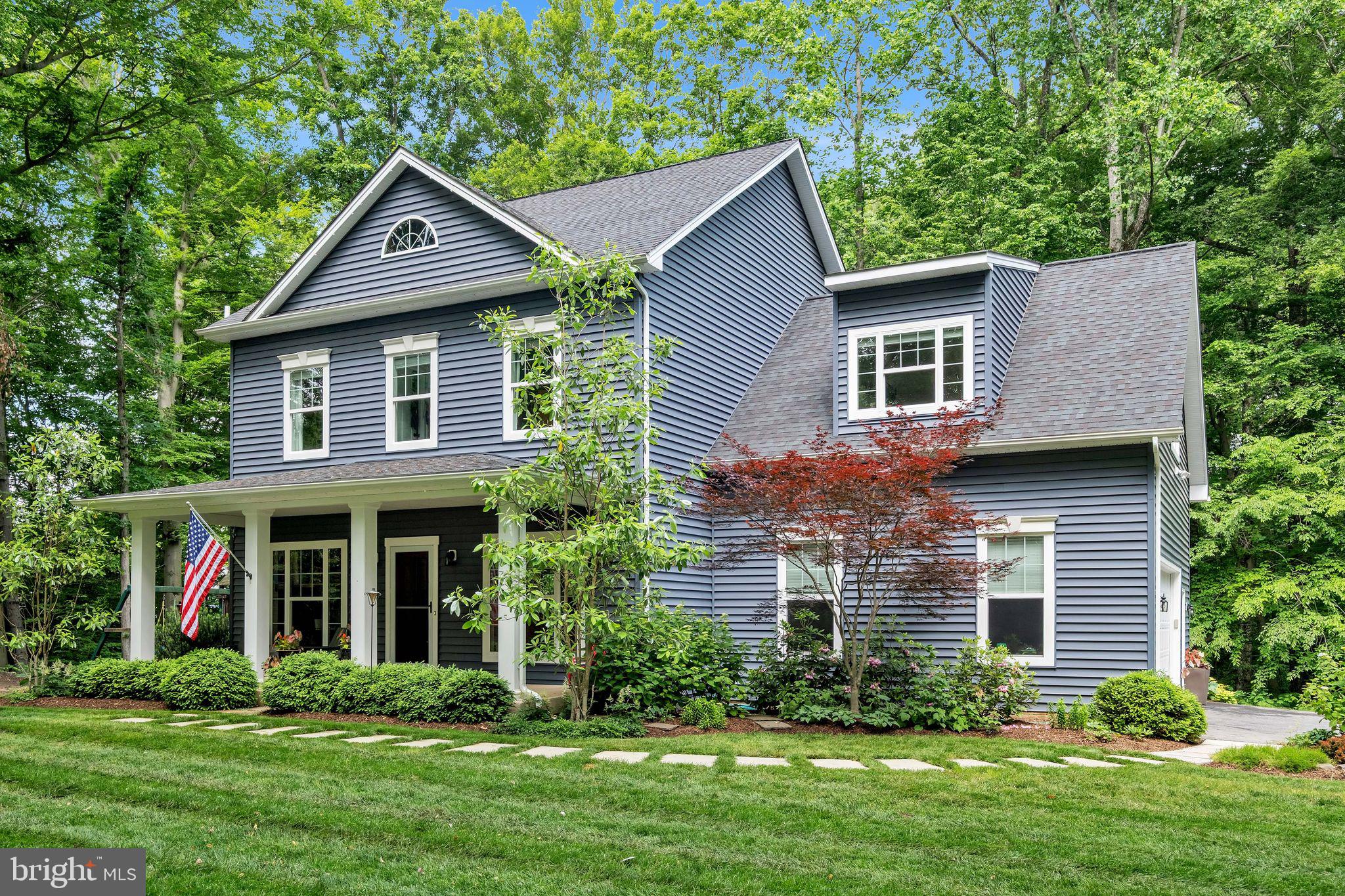 166 Nutwell Road Lothian, MD 20711 - Photo 1 of 29 a front view of a house with a yard and trees