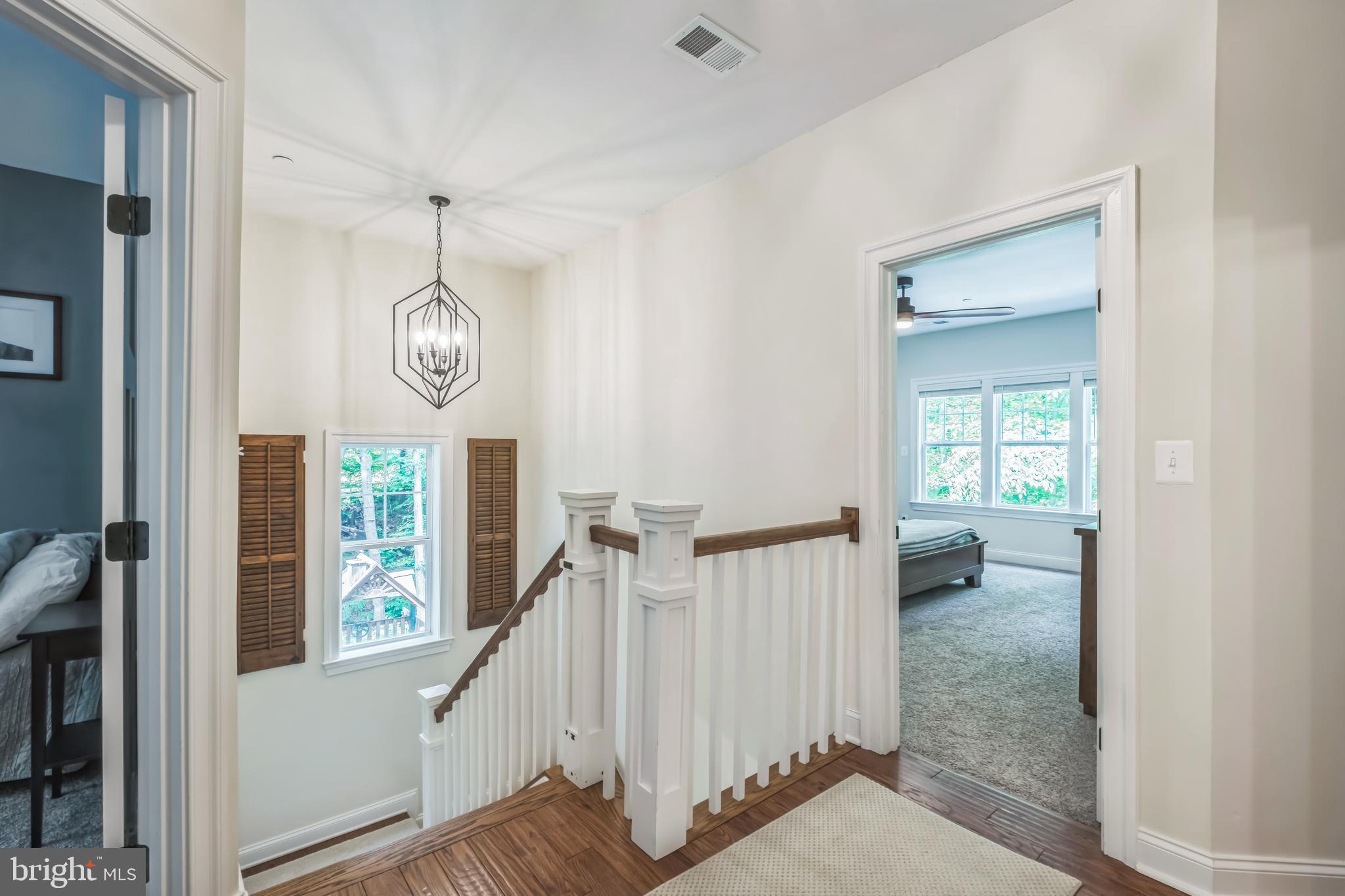 166 Nutwell Road Lothian, MD 20711 - Photo 11 of 29 a view of a hallway with wooden floor and entryway