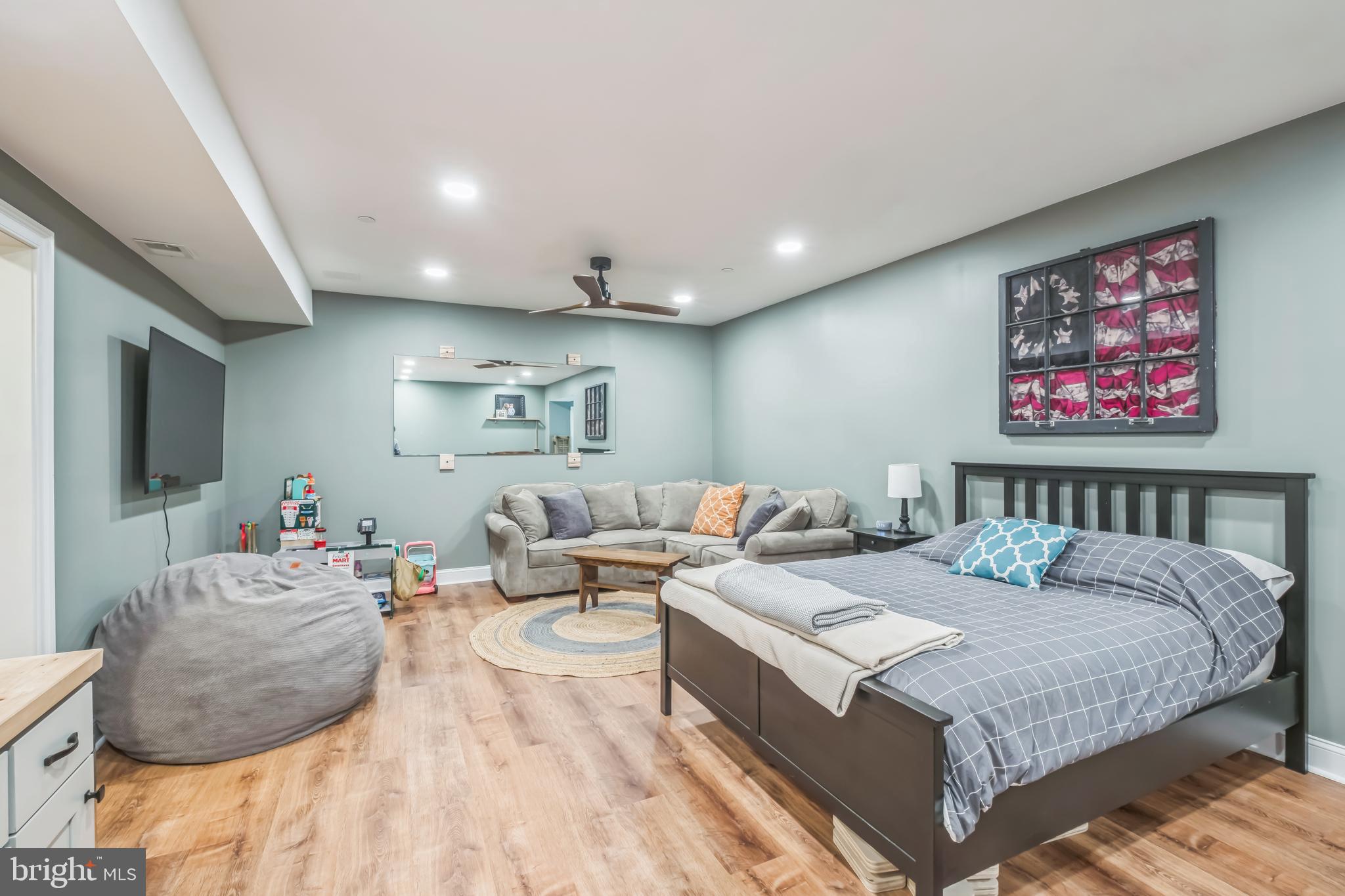 166 Nutwell Road Lothian, MD 20711 - Photo 12 of 29 a bedroom with a large bed and a couch