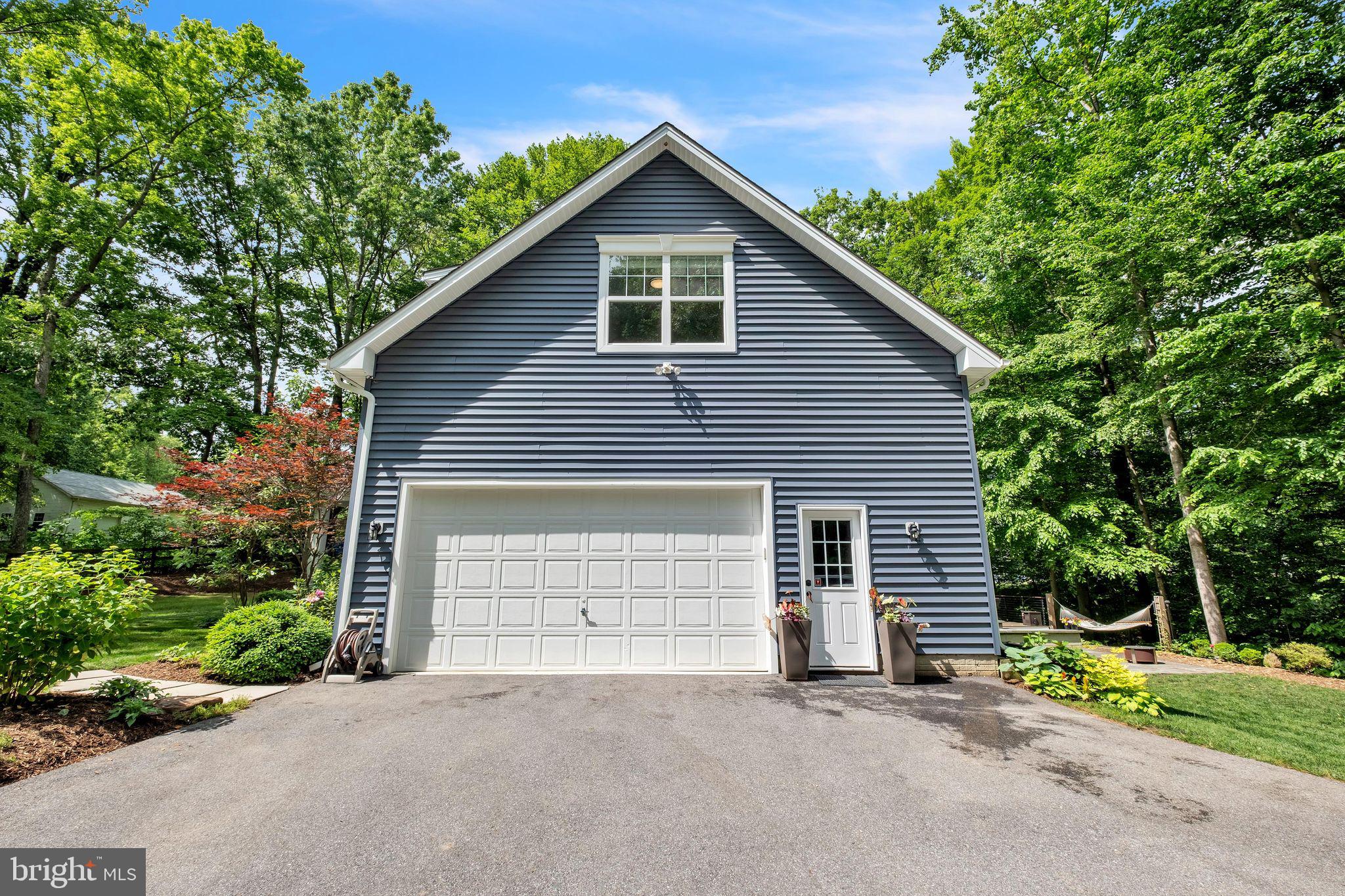 166 Nutwell Road Lothian, MD 20711 - Photo 28 of 29 a front view of a house with a yard and garage