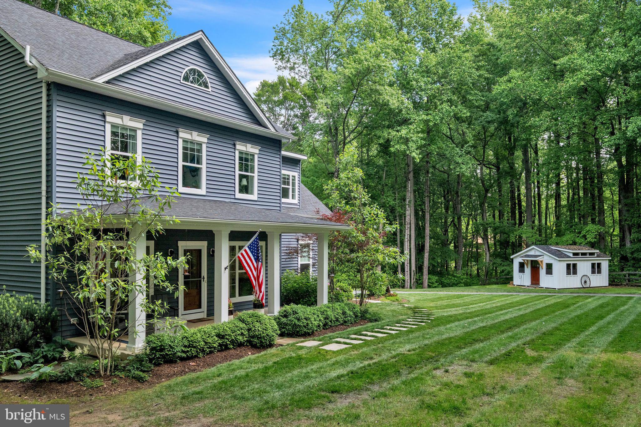 166 Nutwell Road Lothian, MD 20711 - Photo 3 of 29 a view of a house with a yard plants and large tree