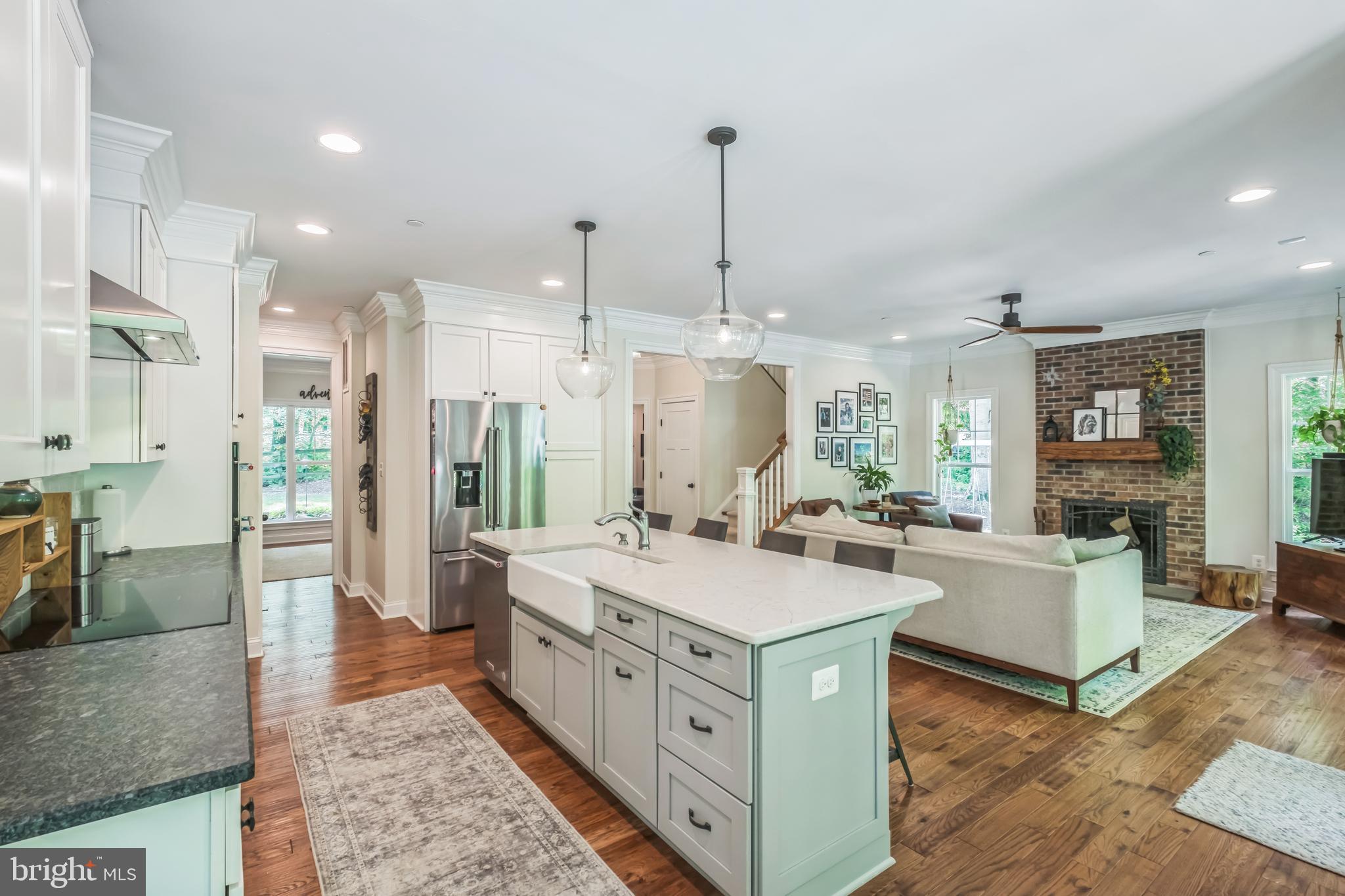 166 Nutwell Road Lothian, MD 20711 - Photo 6 of 29 a large kitchen with kitchen island a large counter space a sink stainless steel appliances and cabinets