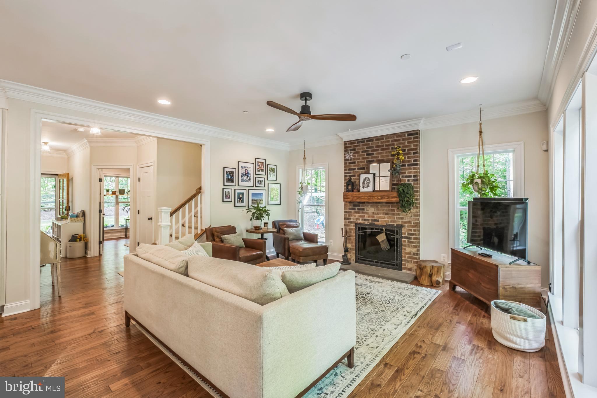 166 Nutwell Road Lothian, MD 20711 - Photo 9 of 29 a living room with furniture fireplace and flat screen tv