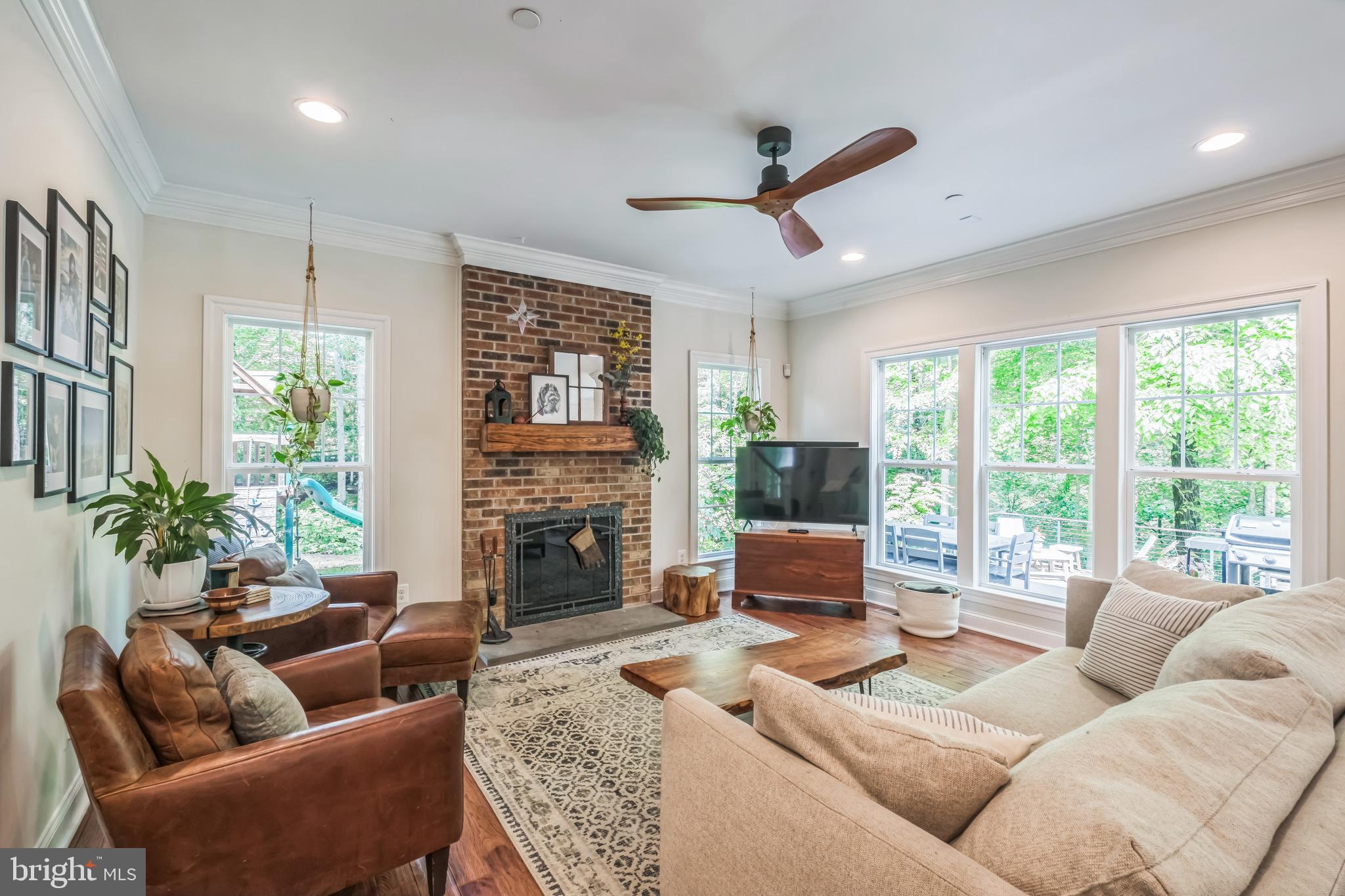 166 Nutwell Road Lothian, MD 20711 - Photo 10 of 29 a living room with furniture fireplace and a large window