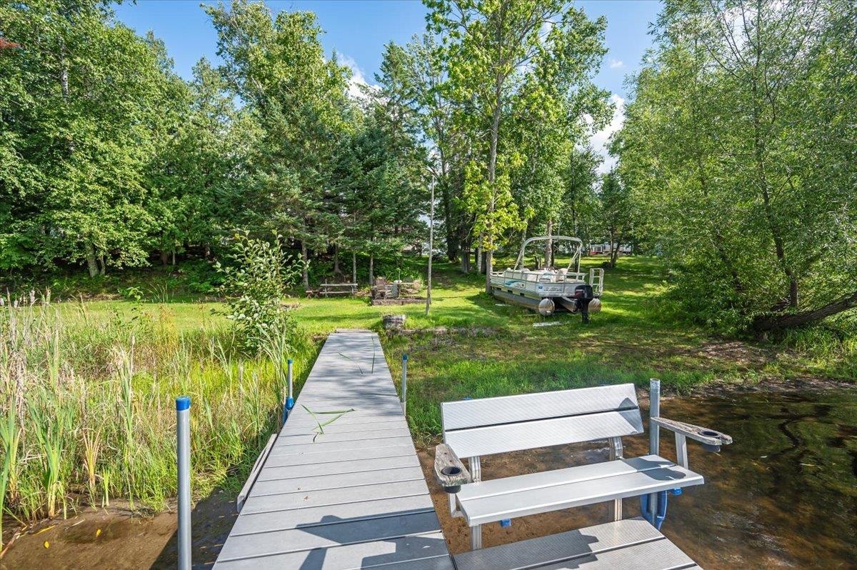 8977 Austin Road Alborn, MN 55702 - Photo 13 of 35 Dock area featuring view of wooded area