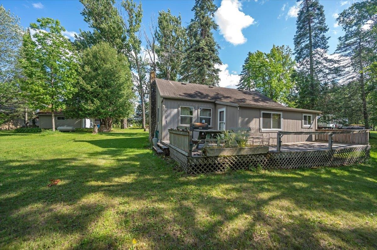 8977 Austin Road Alborn, MN 55702 - Photo 22 of 35 Back of house featuring a lawn and a deck