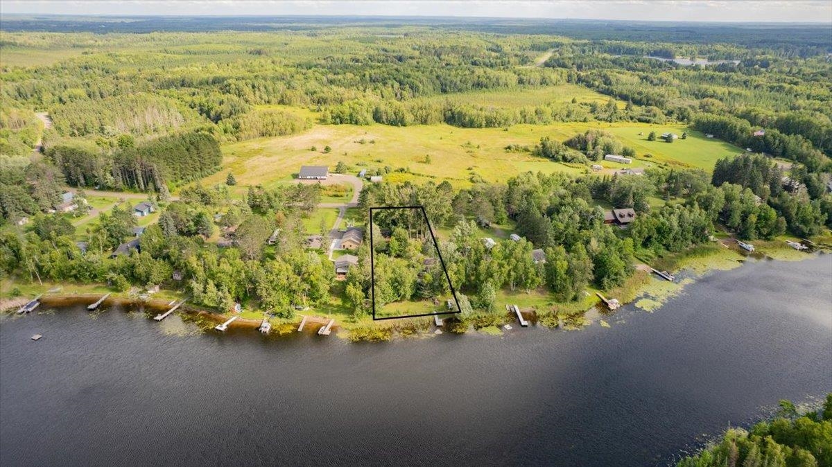 8977 Austin Road Alborn, MN 55702 - Photo 26 of 35 Aerial view of property and surrounding area with a large body of water and property boundaries highlighted