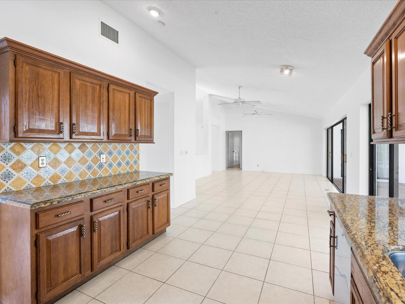 17340 Lake Park Road Boca Raton, FL 33487 - Photo 7 of 33 07-Kitchen to Living