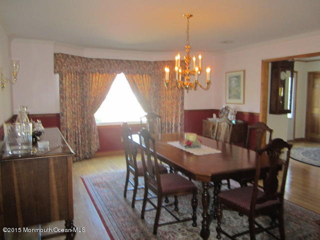 9 Georgetown Road Eatontown, NJ 07724 - Photo 11 of 33 a view of a dining room with furniture and chandelier