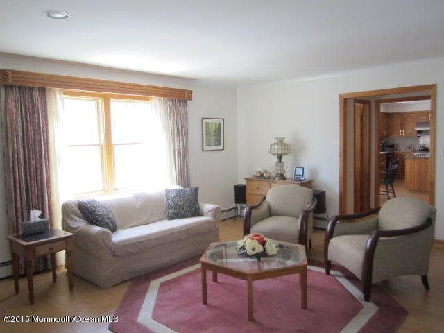 9 Georgetown Road Eatontown, NJ 07724 - Photo 20 of 33 a living room with furniture and a large window