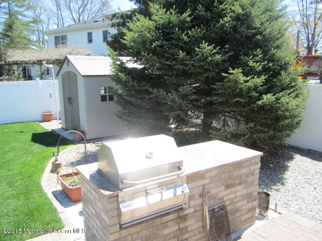 9 Georgetown Road Eatontown, NJ 07724 - Photo 33 of 33 a view of a white house with a sink and a yard