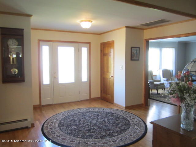 9 Georgetown Road Eatontown, NJ 07724 - Photo 5 of 33 wooden floor with windows and a dining room