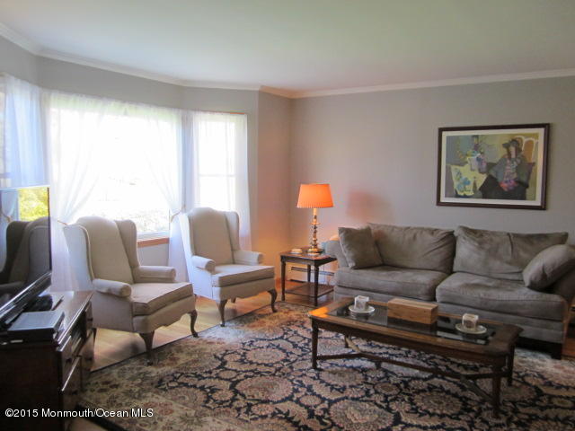 9 Georgetown Road Eatontown, NJ 07724 - Photo 8 of 33 a living room with furniture and a window