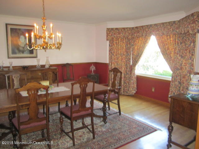 9 Georgetown Road Eatontown, NJ 07724 - Photo 9 of 33 a view of a dining room with furniture and a chandelier
