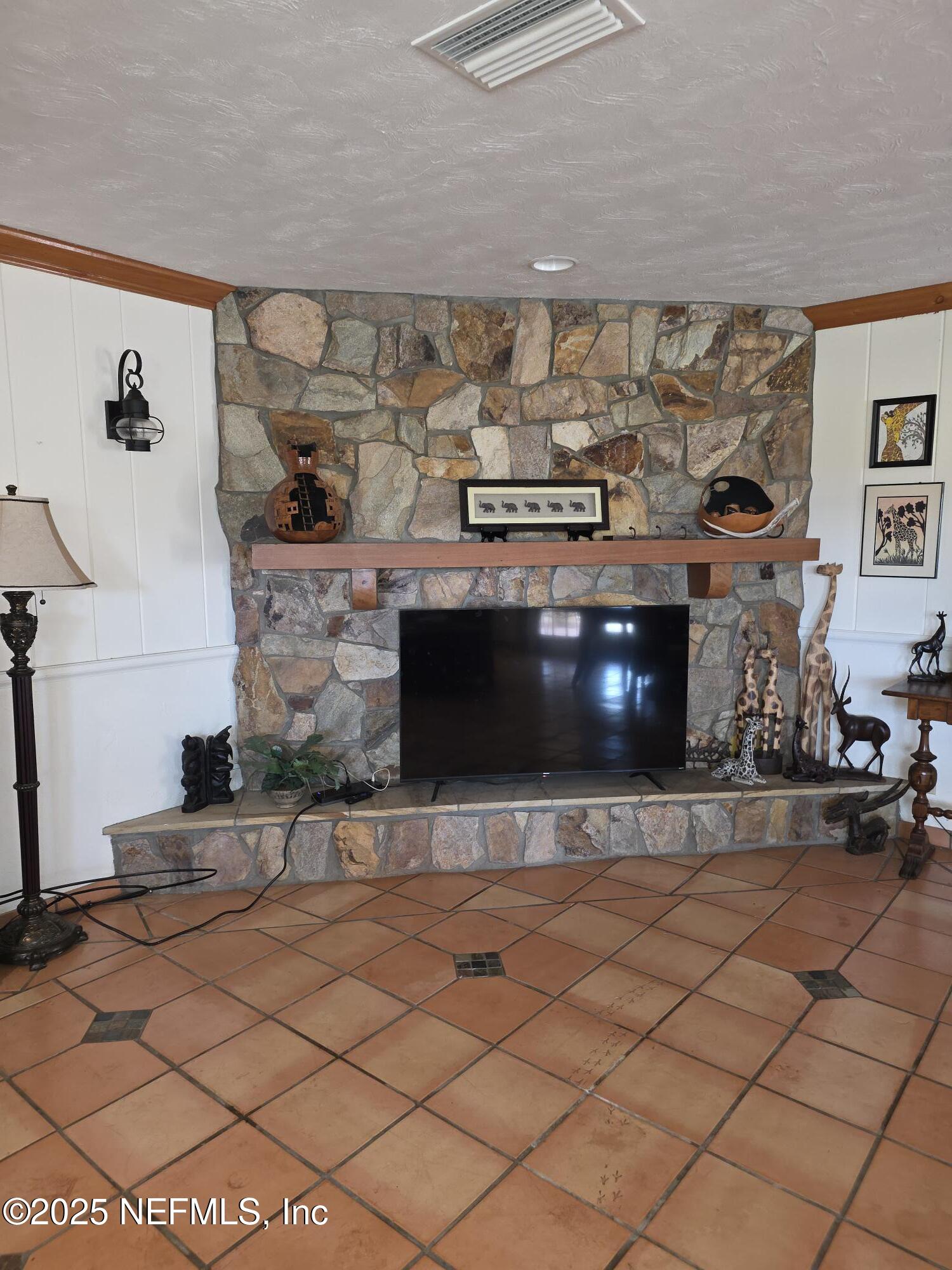 721 Bunnell Road Pierson, FL 32180 - Photo 11 of 59 a living room with stainless steel appliances kitchen island granite countertop a sink and a stove