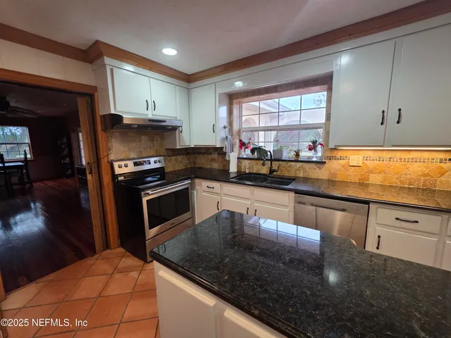 a bathroom with a sink and mirror