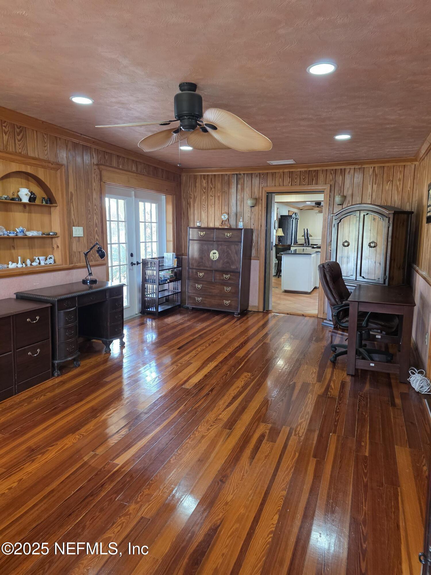 721 Bunnell Road Pierson, FL 32180 - Photo 26 of 59 a living room with furniture and a wooden floor