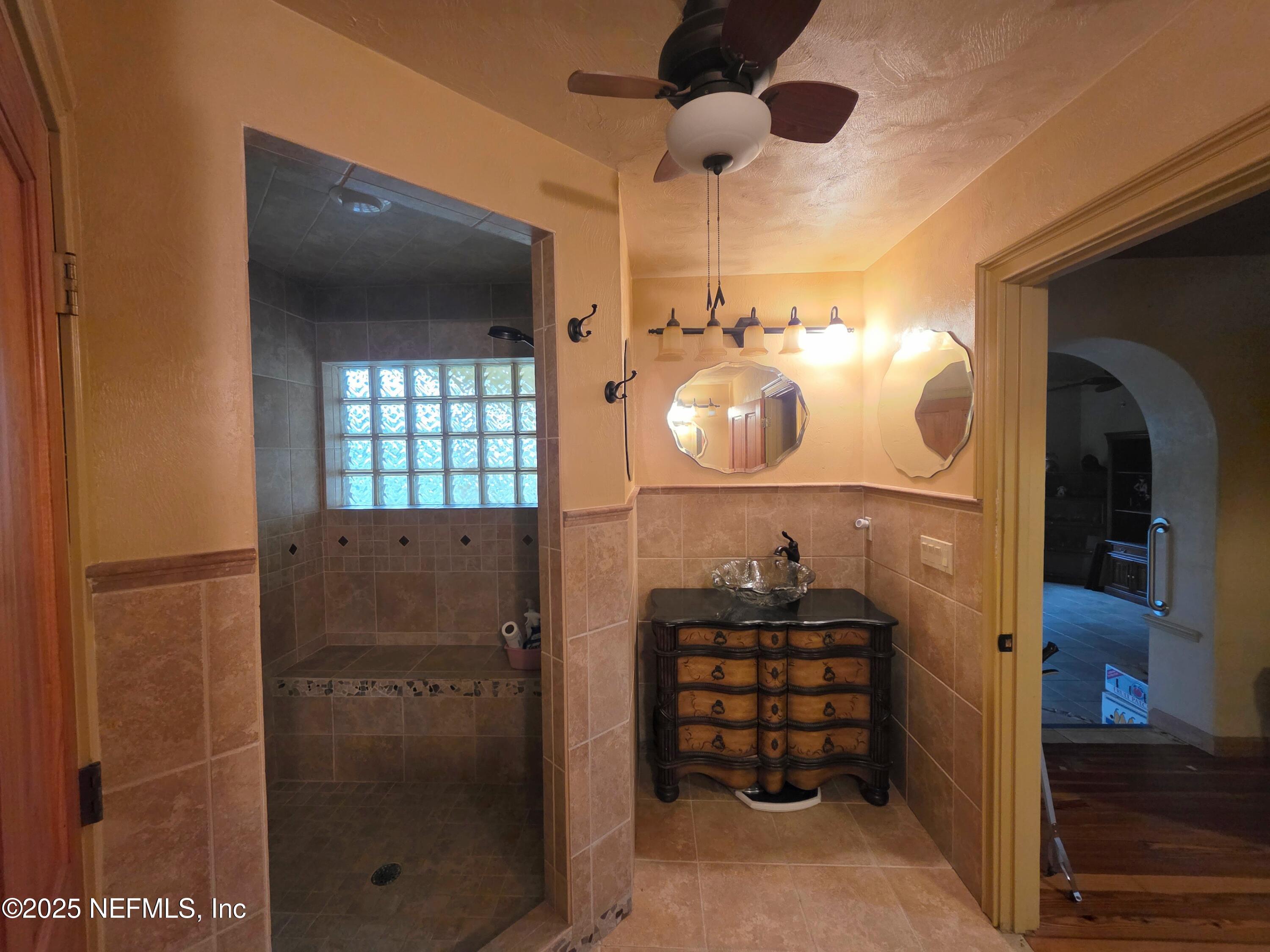 721 Bunnell Road Pierson, FL 32180 - Photo 32 of 59 a bathroom with a sink and a mirror