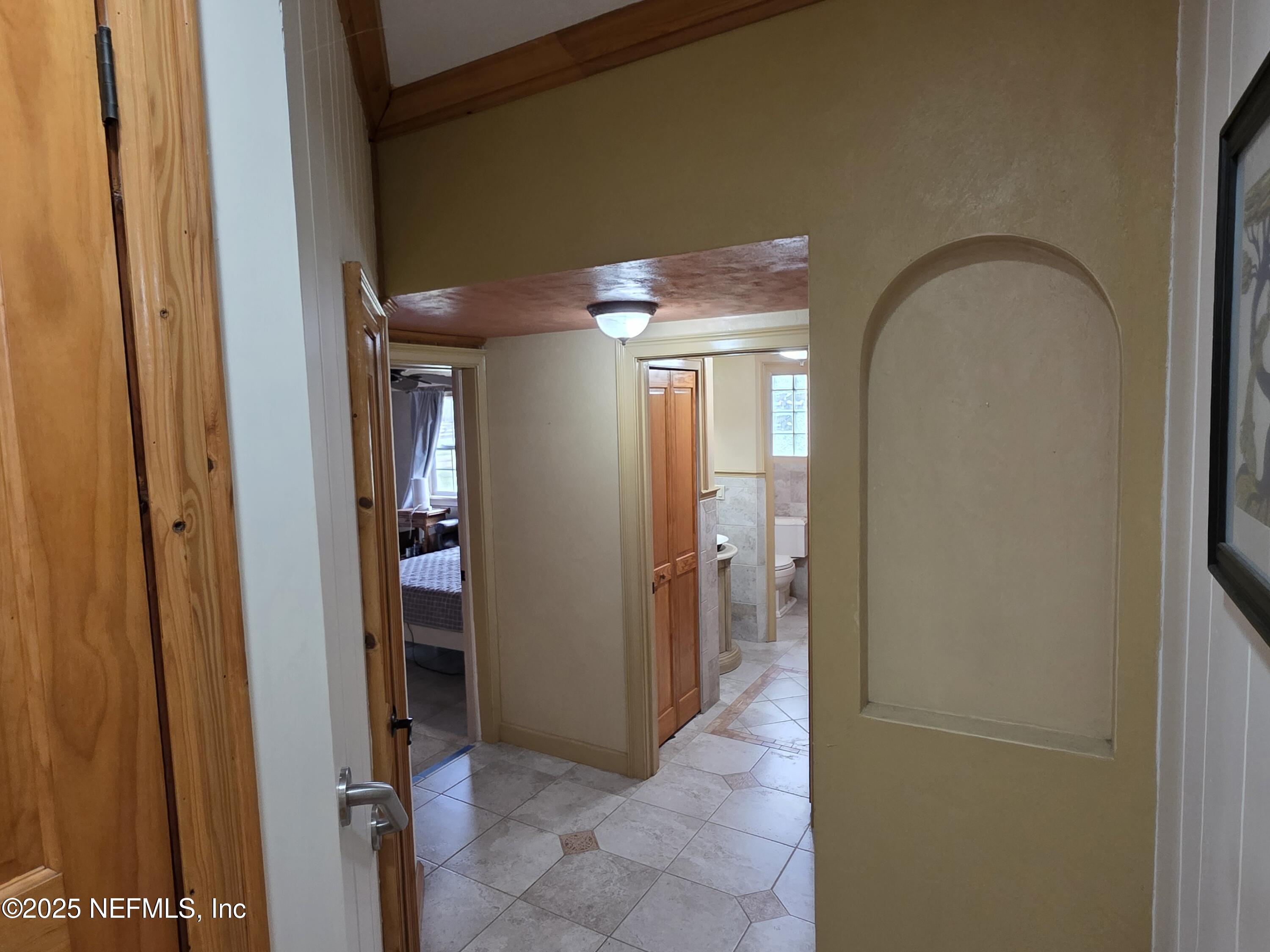 721 Bunnell Road Pierson, FL 32180 - Photo 40 of 59 a view of a hallway with wooden shelves